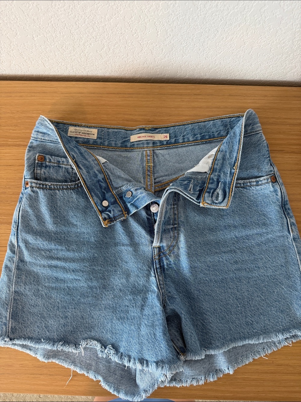 Levi's Medium Wash Frayed Hem Denim Shorts